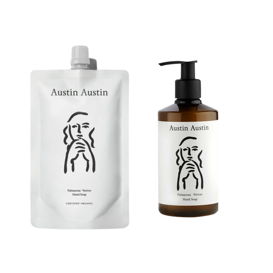 A bottle of Austin Austin Hand soap with a refill pouch of the same soap next to it