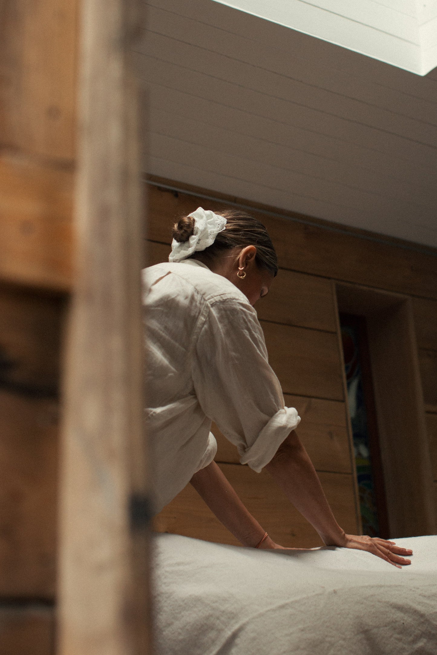 Olivia Crighton energy healer in a white linen shirt practicing energy medicine treatment in sussex and east London