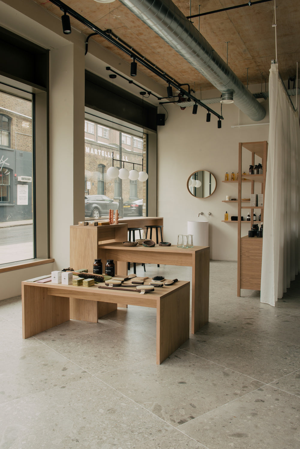 Glasshouse salon retail area with organic and natural beauty products East London