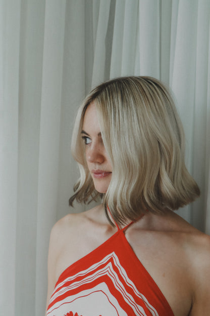 A woman with a short blonde bob is shown in profile at Glasshouse salon for a Bespoke hair treatment and blowdry 