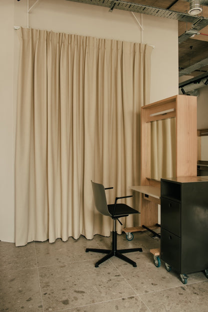 Glasshouse Salon cutting station with mirror, chair and curtains 