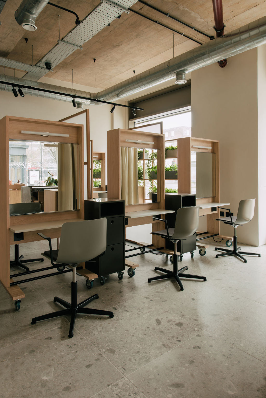 Glasshouse Hair Salon East London. Three stations with hairdressing chairs and mirrors. 