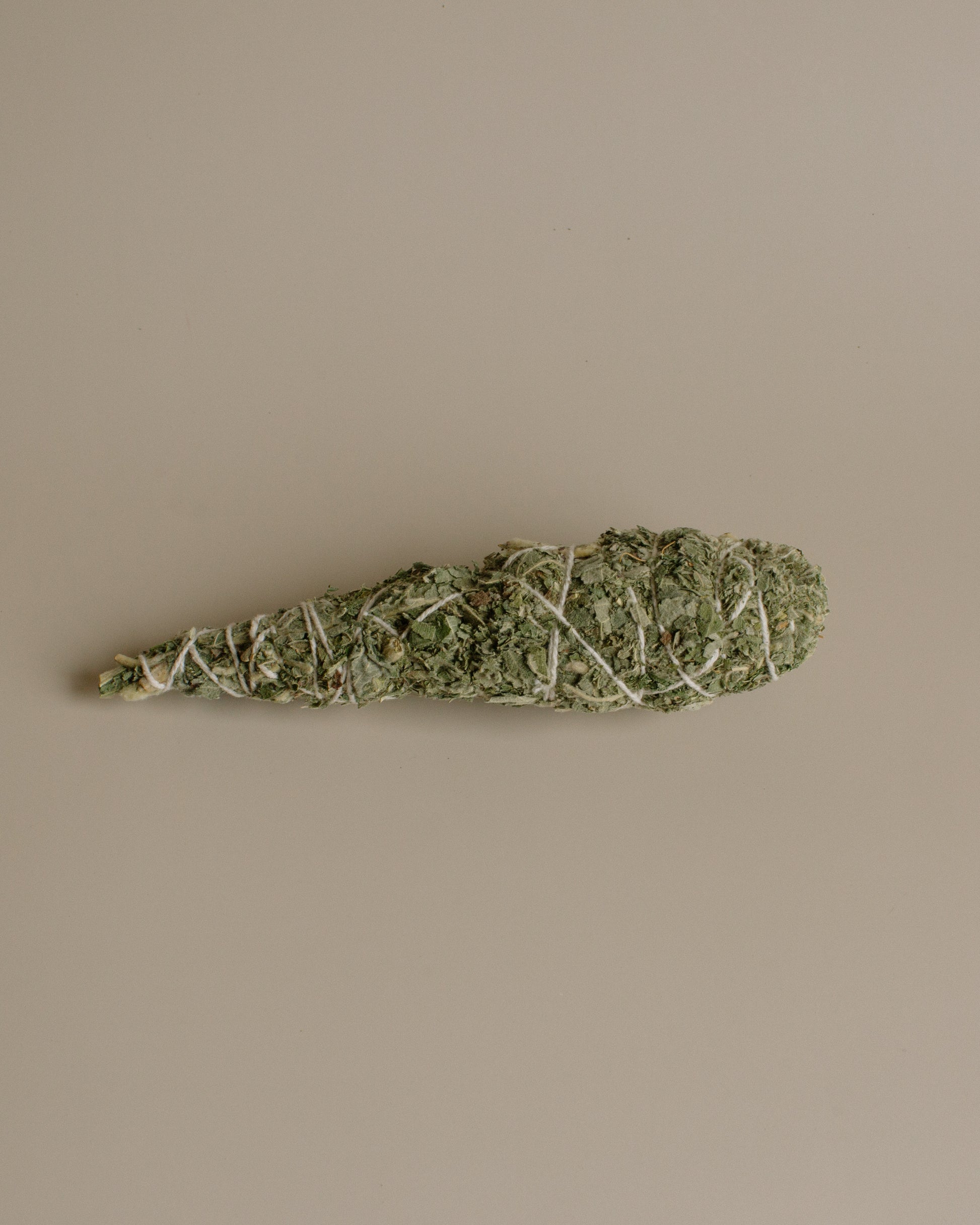 Cones of dried Himalayan Sage Smudges on a beige background