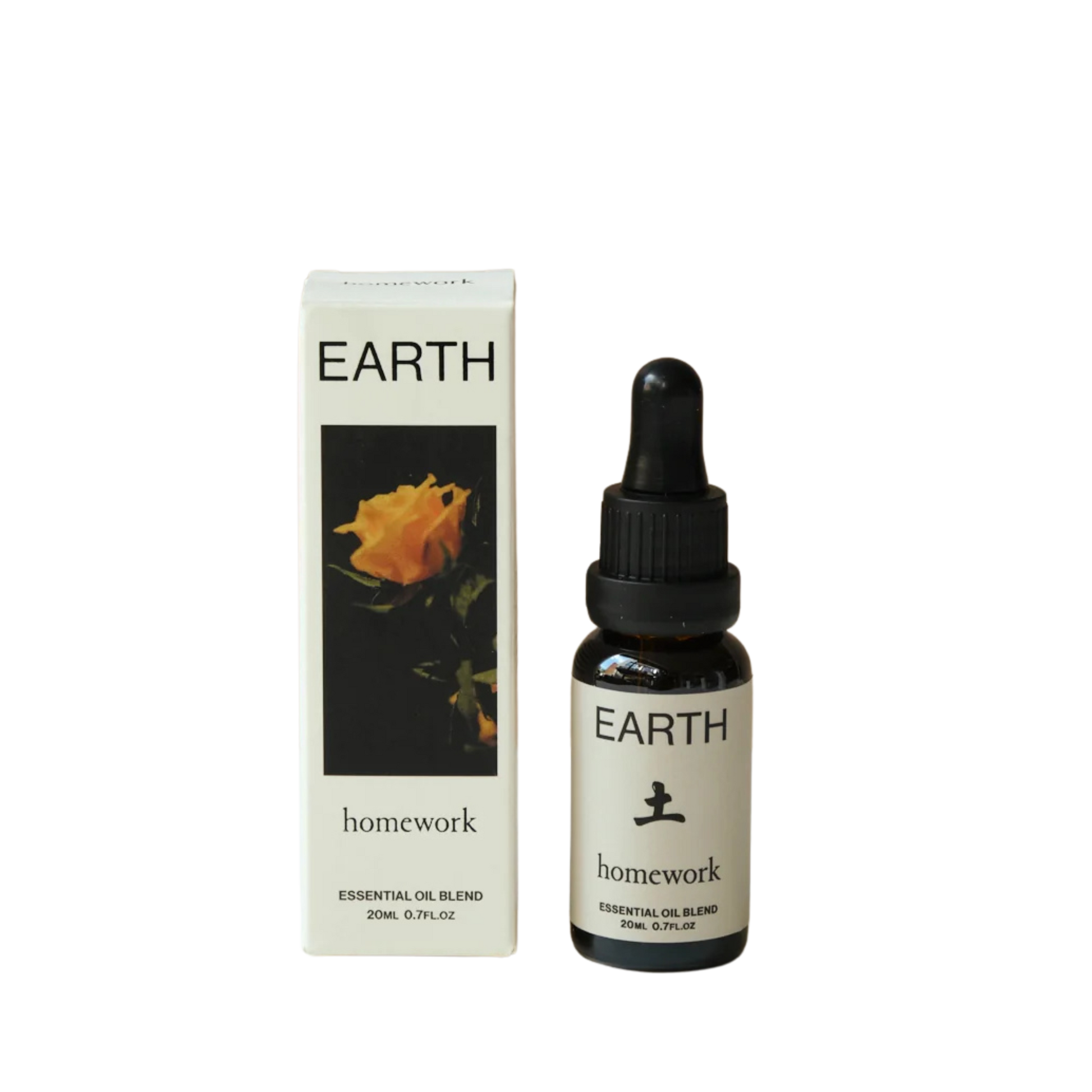 Earth homework essential oil blend bottle and packaging on a white background