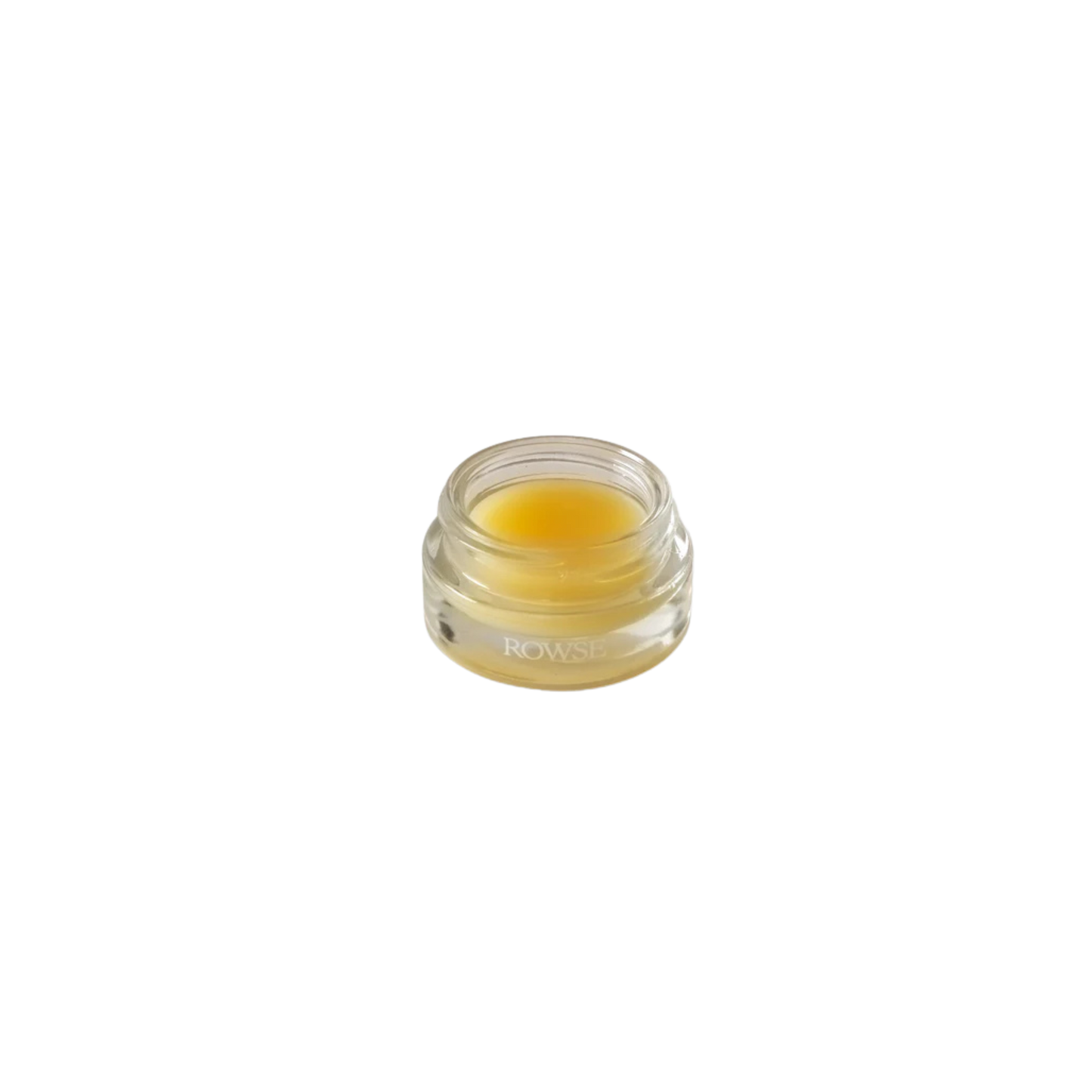 Small clear jar with yellow lip balm 