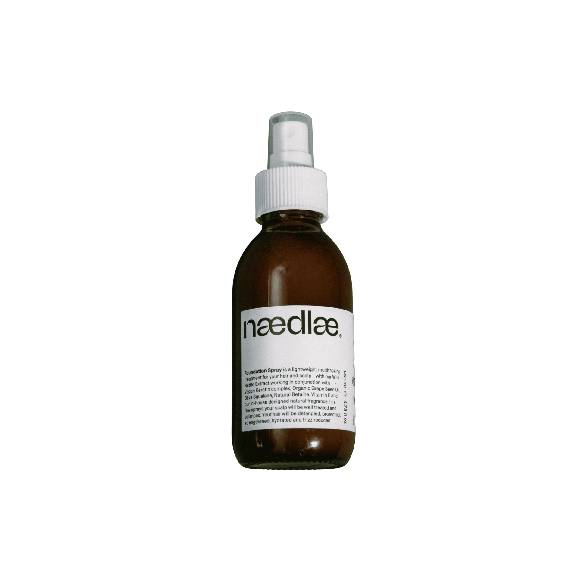 Brown spray bottle with white label on a white background