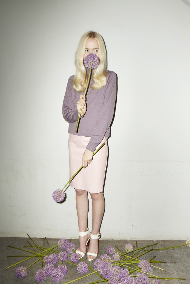 Blonde model with purple botanicals