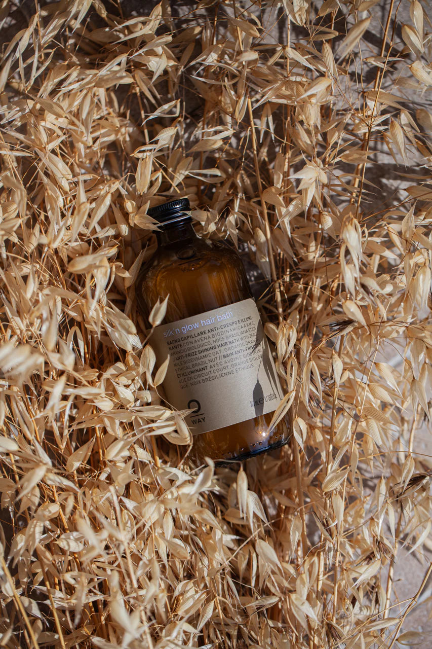 Amber bottle with a label on a bed of straw