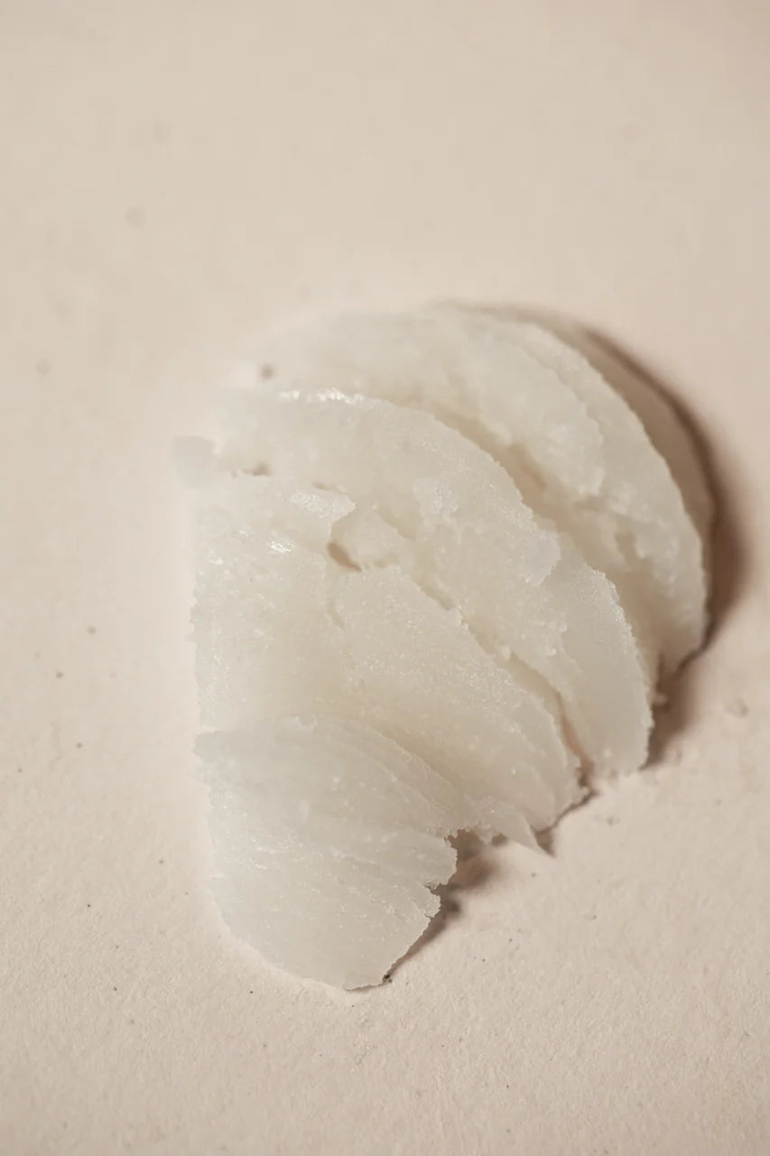 Close-up of a swatch of product on a beige surface