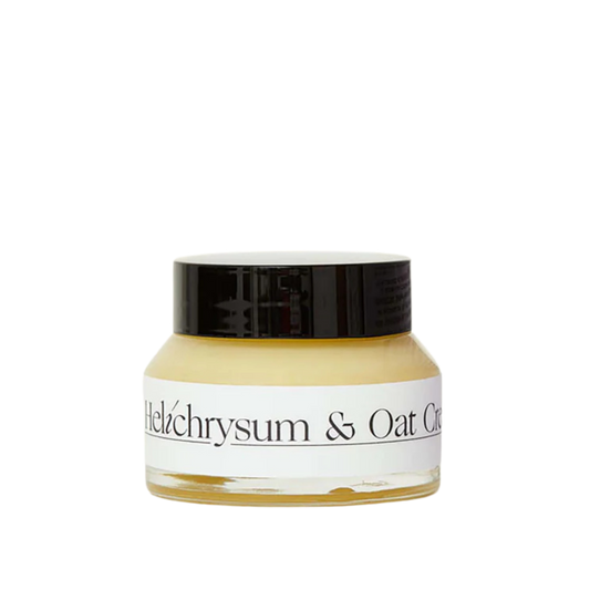 Jar of Helichrysum & Oat Cream with black lid on a white background