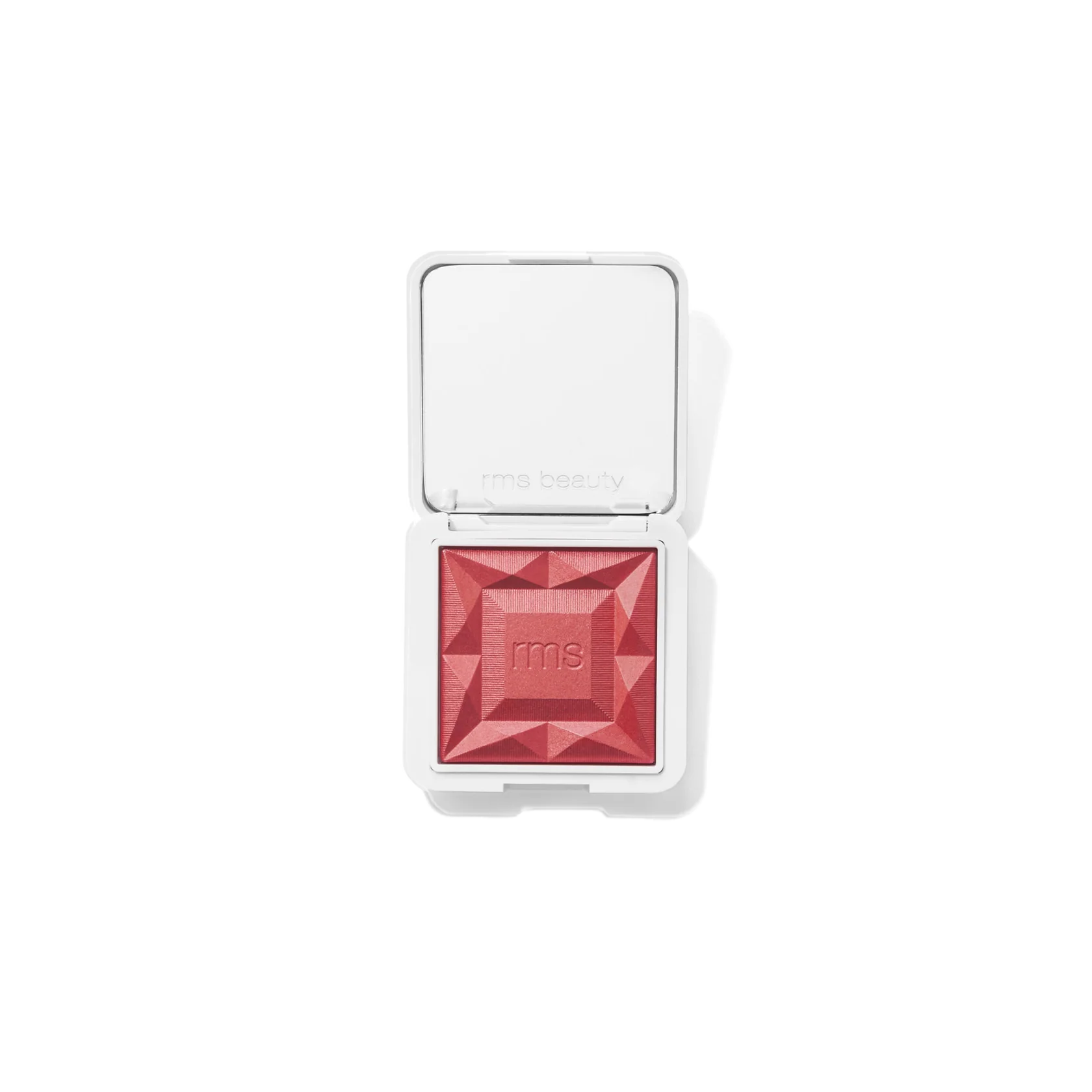 RMS Beauty ReDimension Hydra Powder Blush - Kir Royal diamond-shaped pressed powder blush in a vibrant coral pink shade, housed in a white compact with an open mirror lid, shown on a clean white background.