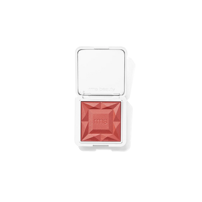 RMS Beauty ReDimension Hydra Powder Blush - Sangria, diamond-shaped pressed powder blush in a coral pink shade, shown in an open white compact with a mirror on a white background.