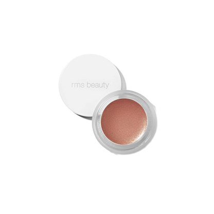 RMS Beauty Peach Luminizer in clear glass jar against plain white background showing warm bronze-peach cream highlighter texture