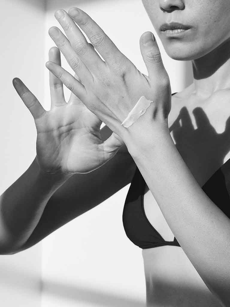 Black and white photo of moisturised skin using Sans Ceuticals Cellx 5 Face and body lotion 