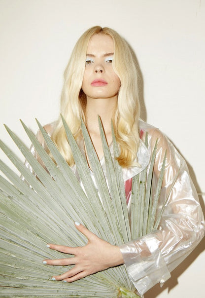Side profile close-up showing smooth healthy hair texture and natural blonde tones following gentle root touch-up with plants