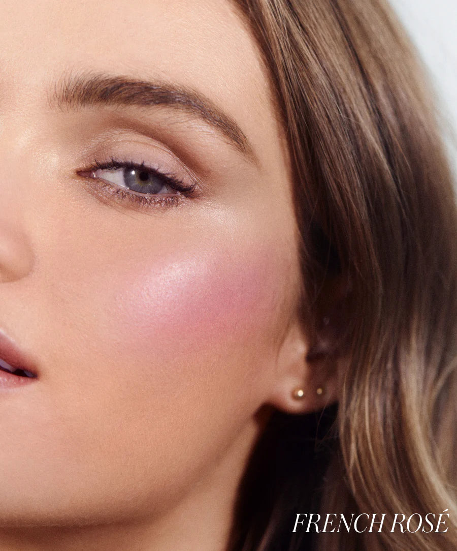 Close-up of a person's face with pink blush and 'French Rosé' text.