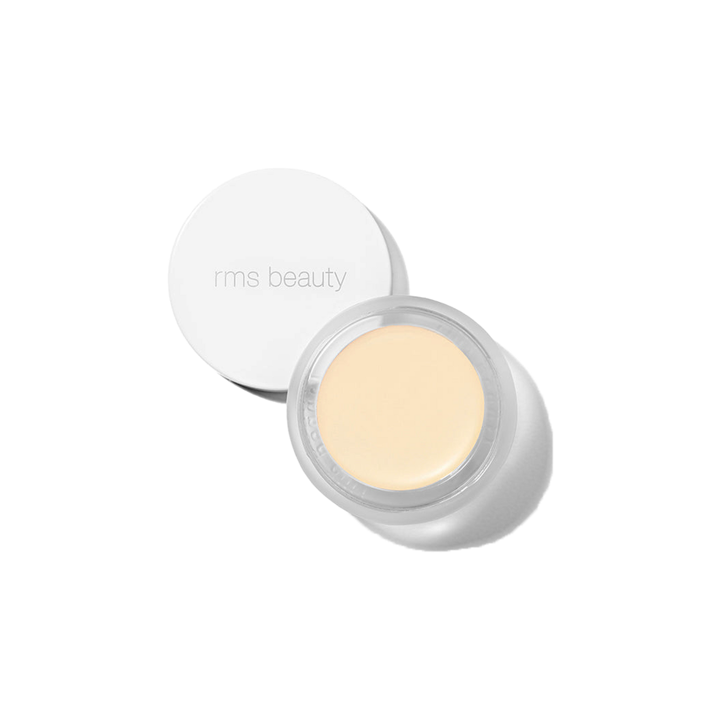 RMS Beauty UnCover-Up cream concealer in shade 000 lightest alabaster in clear glass jar with white lid on transparent background