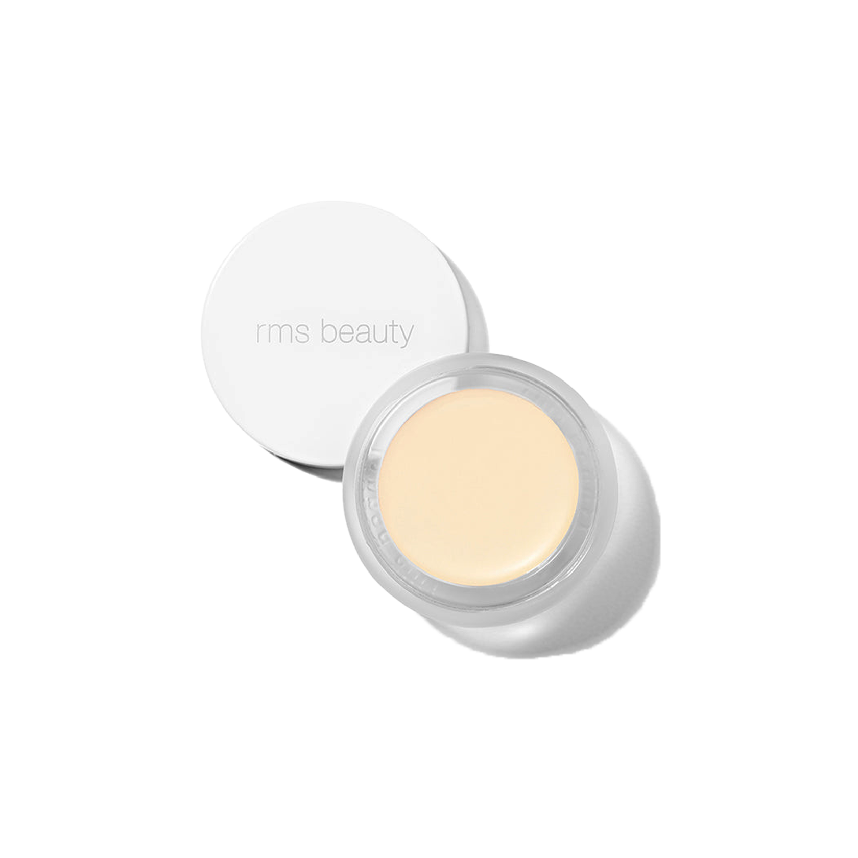 RMS Beauty UnCover-Up cream concealer in shade 000 lightest alabaster in clear glass jar with white lid on transparent background