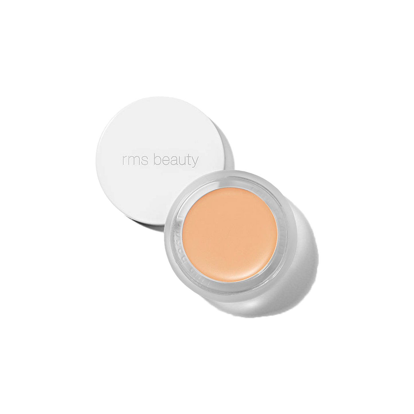 RMS Beauty UnCover-Up cream concealer shade 11.5 in open glass jar with white lid against a transparent background