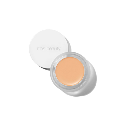 RMS Beauty UnCover-Up cream concealer shade 11.5 in open glass jar with white lid against a transparent background