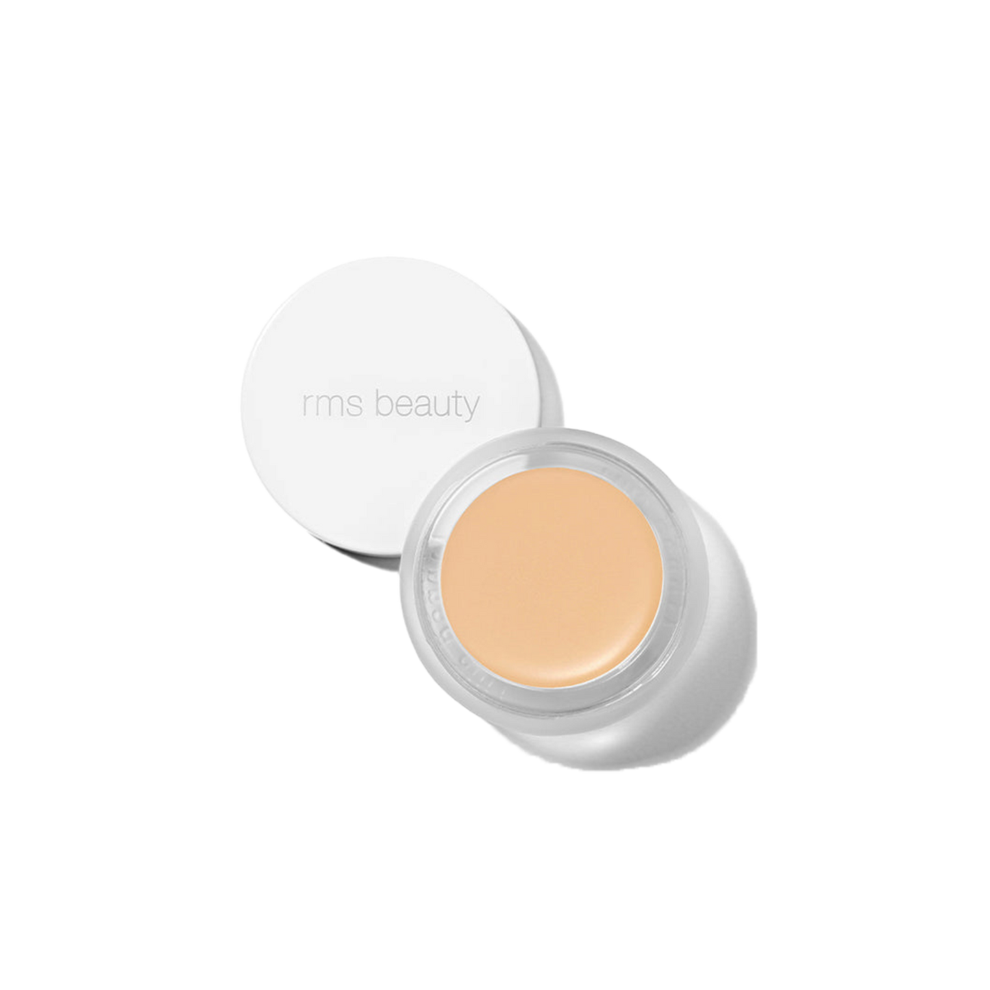 RMS Beauty UnCover-Up cream concealer in shade 11 pale ivory with golden base in clear glass jar on transparent background