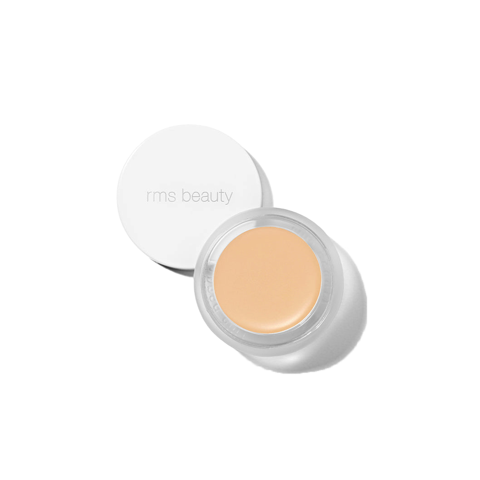 RMS Beauty UnCover-Up cream concealer in shade 11 pale ivory with golden base in clear glass jar on transparent background