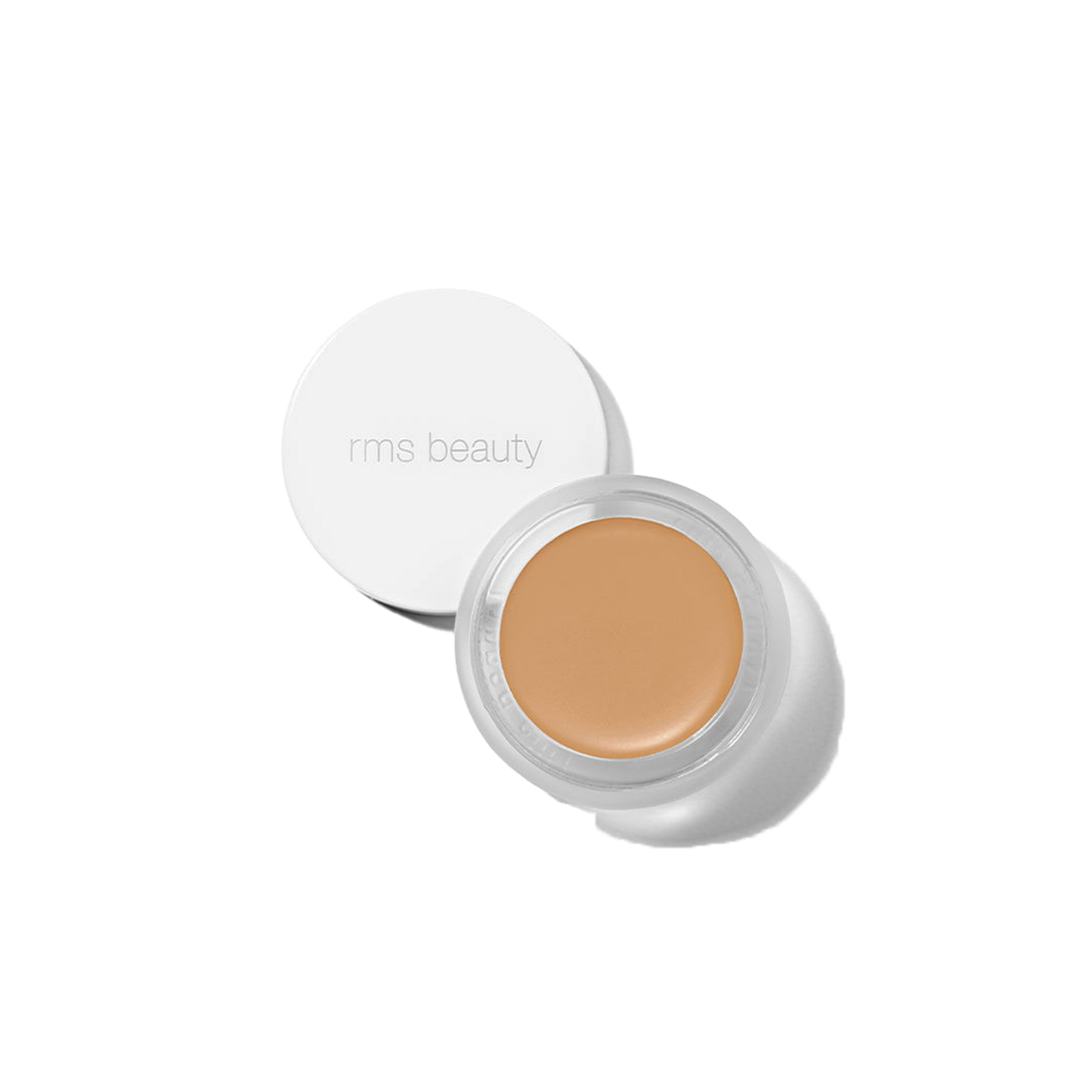 RMS Beauty UnCover-Up cream concealer in shade 33.5 warm tawny peach corrector in clear glass jar on transparent background