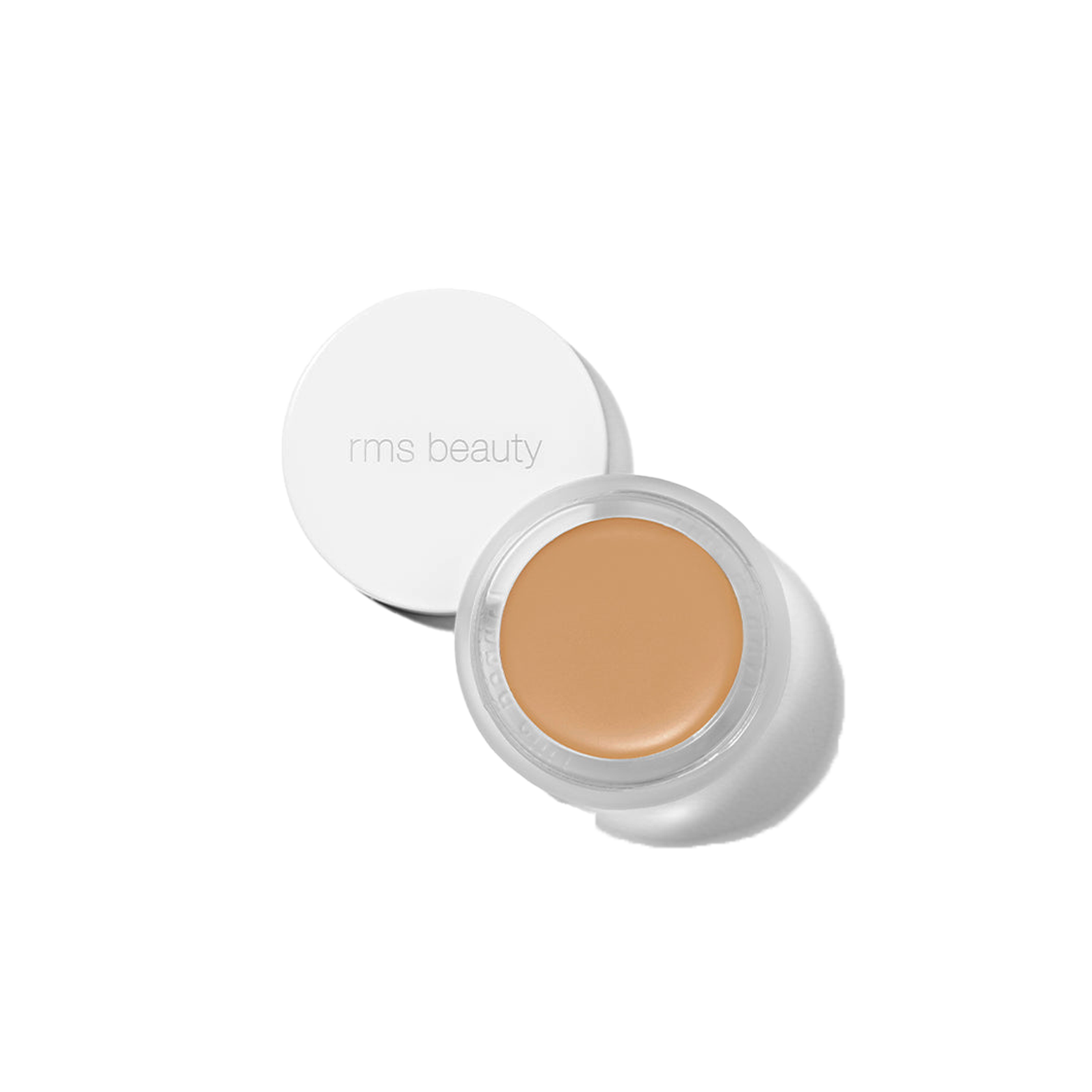 RMS Beauty UnCover-Up cream concealer in shade 33.5 warm tawny peach corrector in clear glass jar on transparent background