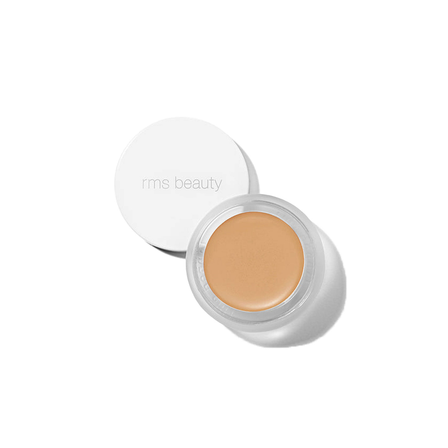 RMS Beauty UnCover-Up cream concealer in shade 33 warm beige in clear glass jar on transparent background