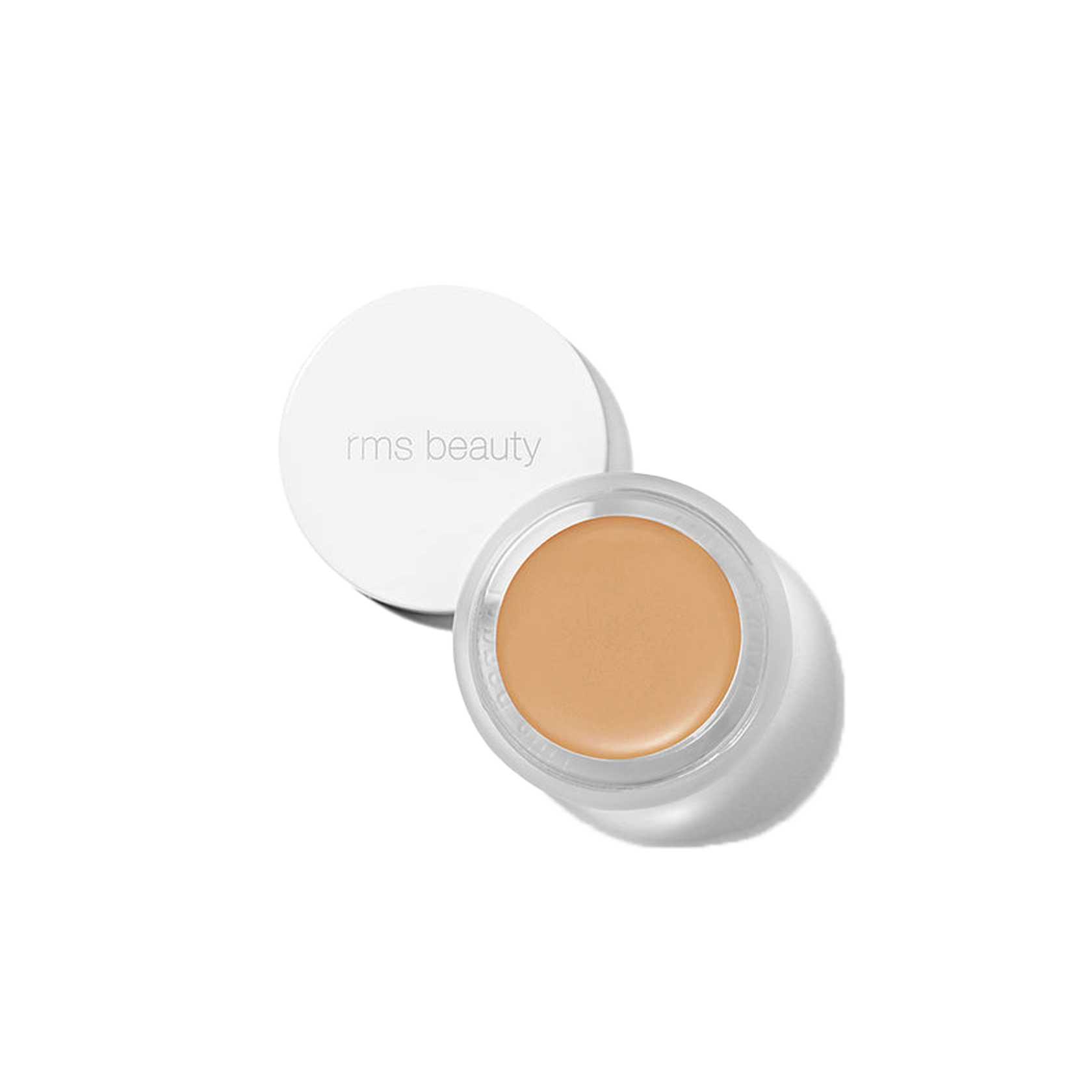 RMS Beauty UnCover-Up cream concealer in shade 33 warm beige in clear glass jar on transparent background