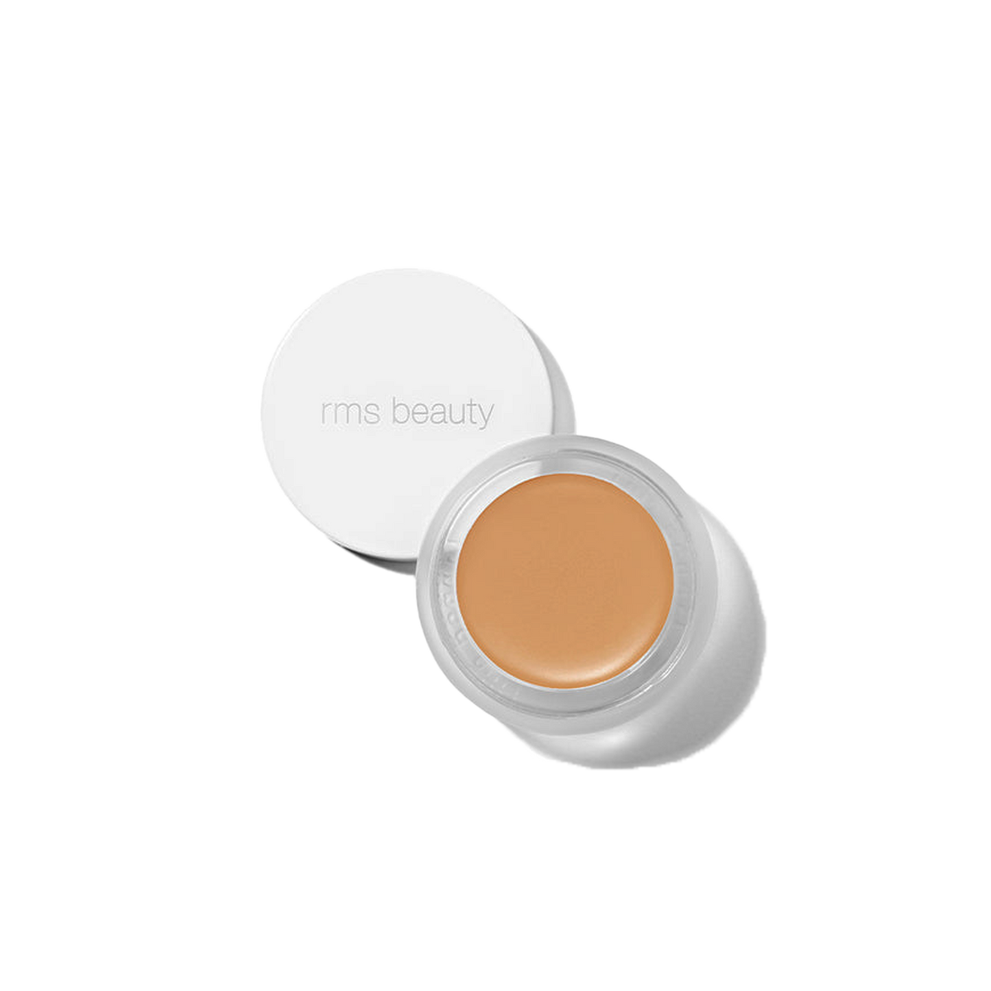 RMS Beauty UnCover-Up cream concealer in shade 44 medium honey cool undertones in clear glass jar on transparent background