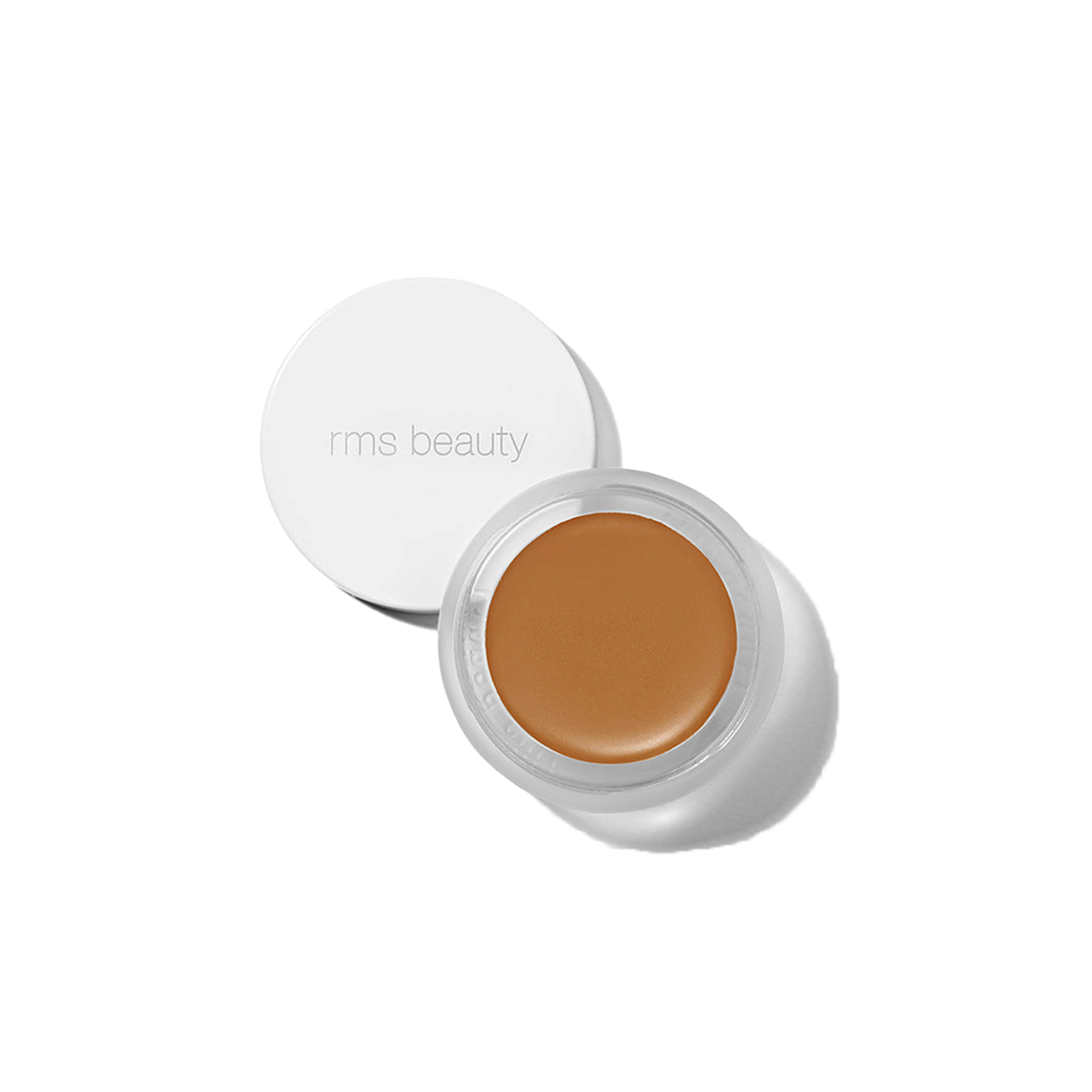 RMS Beauty UnCover-Up cream concealer in shade 66 golden sienna in clear glass jar on transparent background