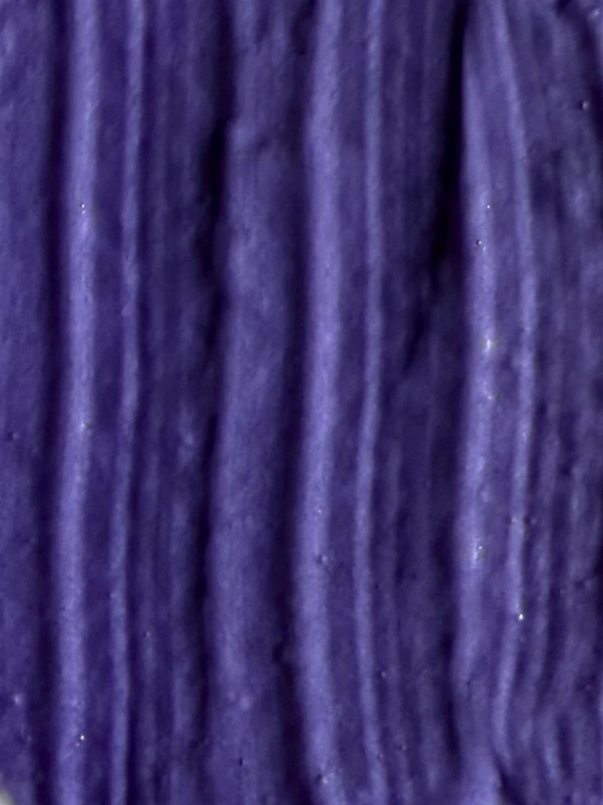Close-up texture swatch of WIIG Blonde 0/01 Toning Treatment showing the rich, deep violet-pigmented cream for ash blonde hair.