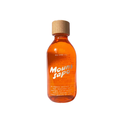 A clear bottle with orange tinted oil and a wooden cap, labeled 'Mount Sapo All Over Oil 200ml'.