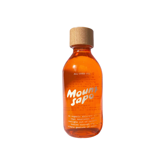 A clear bottle with orange tinted oil and a wooden cap, labeled 'Mount Sapo All Over Oil 200ml'.