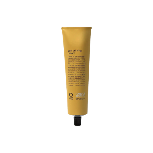 A tube of Curl Priming Cream by OWAY designed for curly hair, with organic and cruelty-free indications.